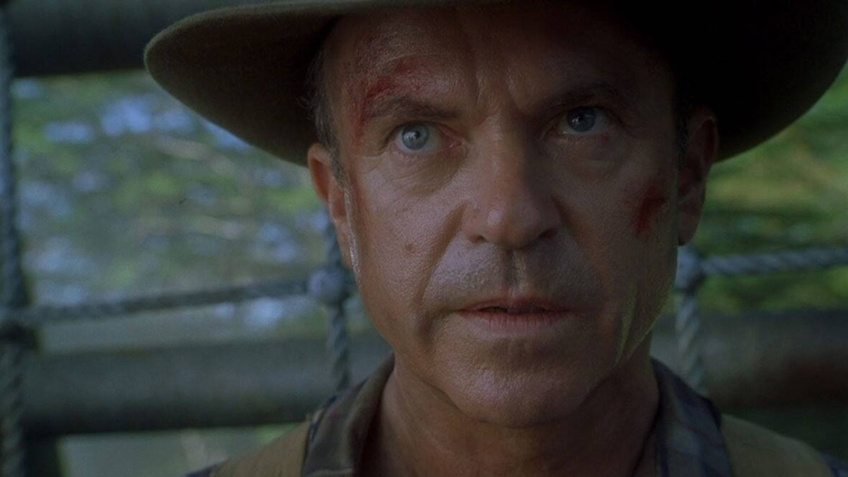 Cena de 'Jurassic Park' (1993) com o personagem Alan Grant, interpretado por Sam Neill - Reprodução:Universal Studios